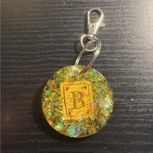 Yellow circle “B” keychain $10